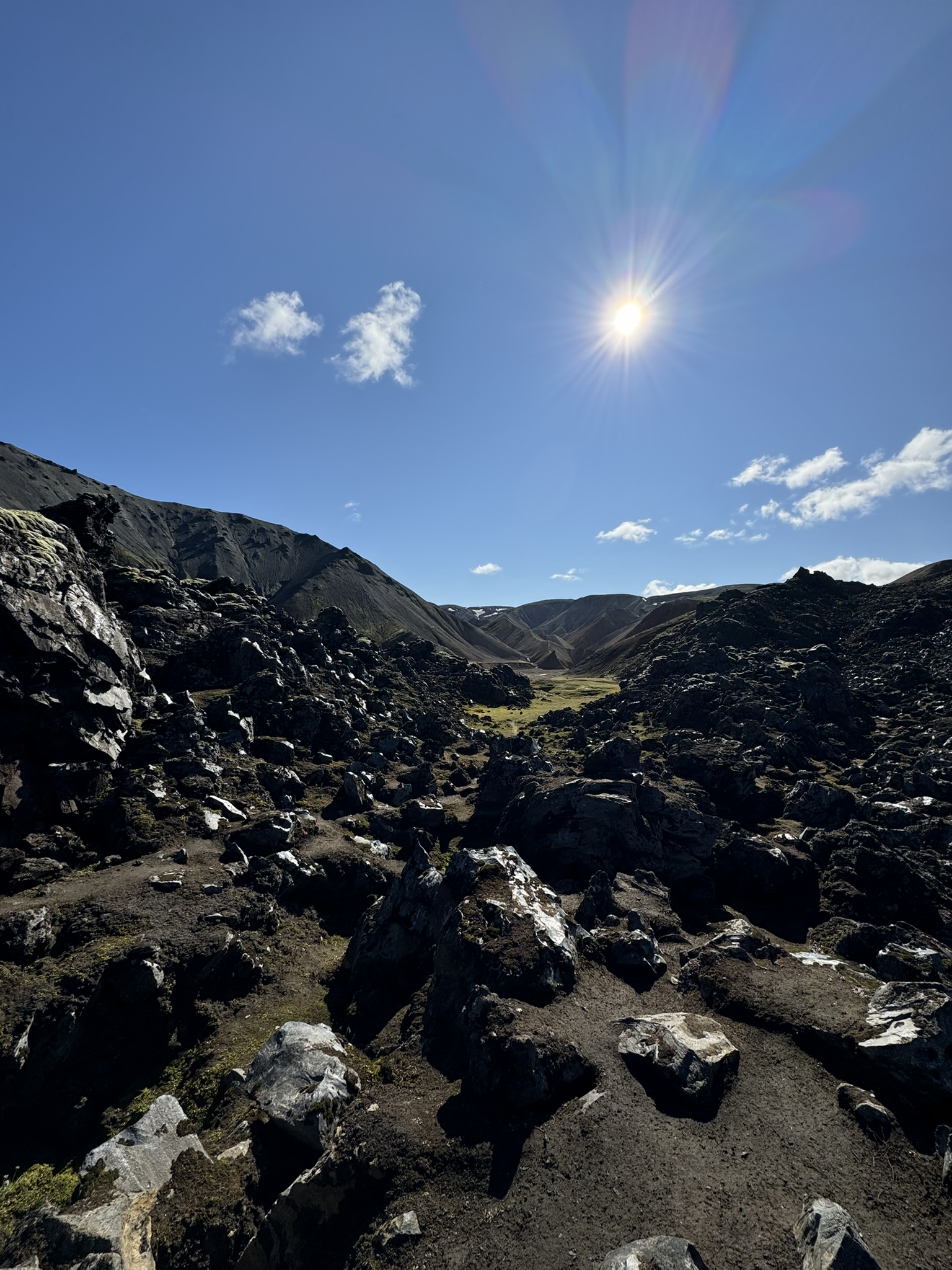Rocky volcanic landscape with bright sun
