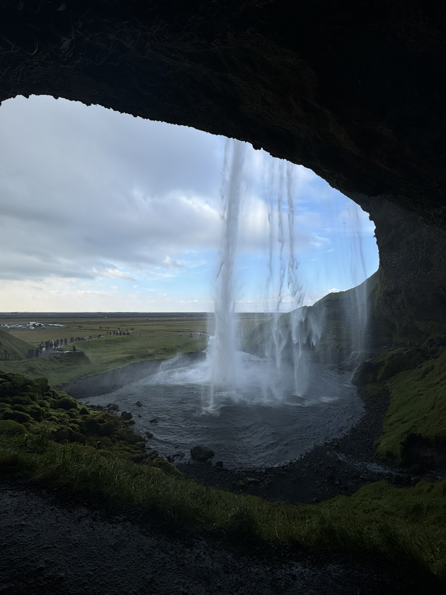 Waterfall viewed from inside a cave